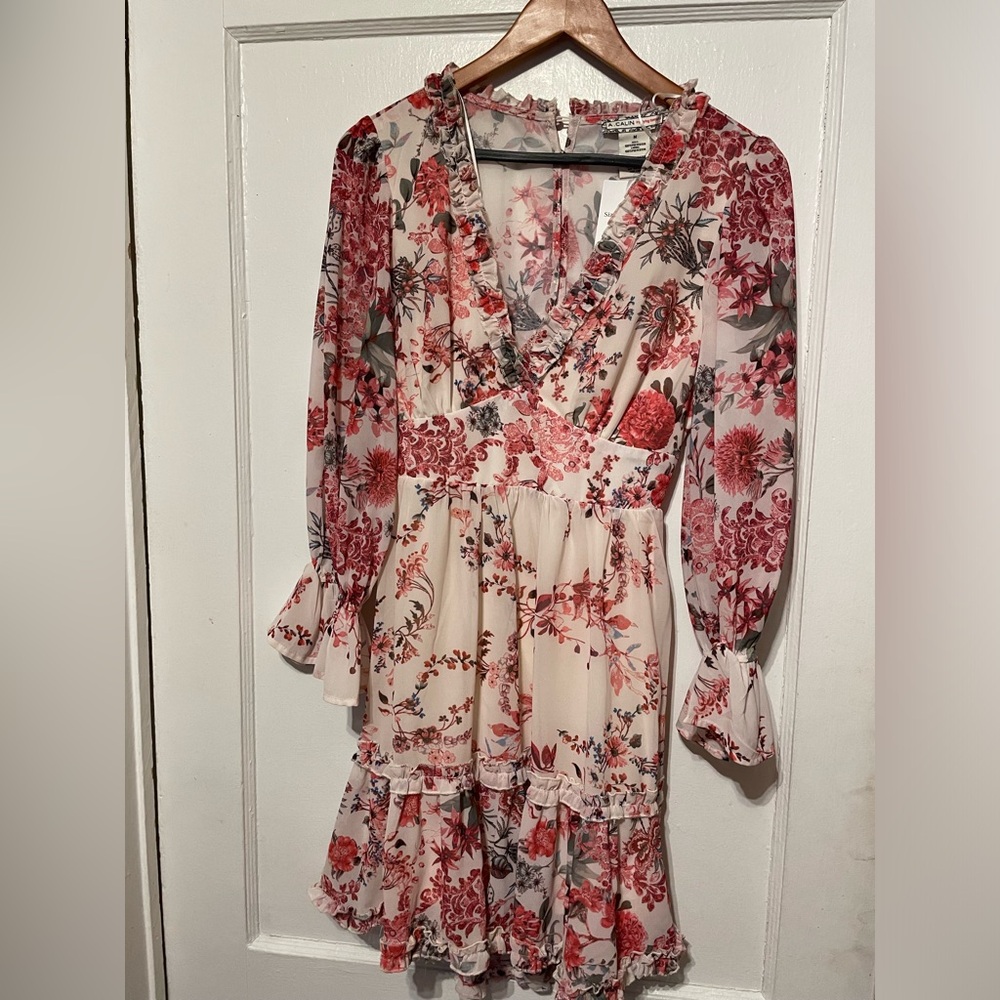 Size Medium, floral pattern. A Peach by Flying Tomato brand.